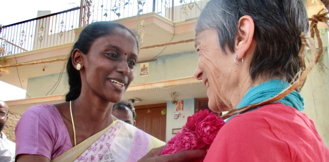 Mrs. Jayanthi, the Managing Trustee of Women's Voice Trust, in Chinnamanur, Theni District, welcoming RSWR Board member Marian Beane to their brick-making project.